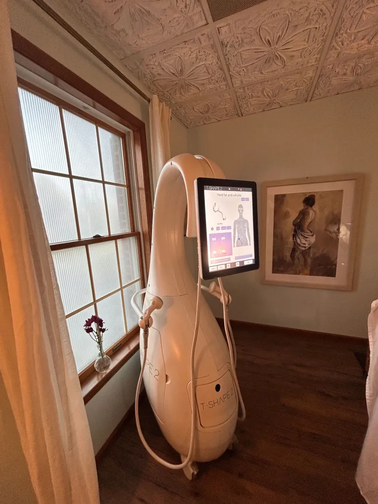 The Tshape 2 device in a treatment room beside a tall window